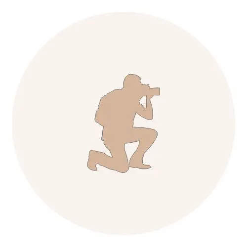 Icono de fotógrafo que simboliza la fotografía profesional de bodas y el conocimiento de la isla.